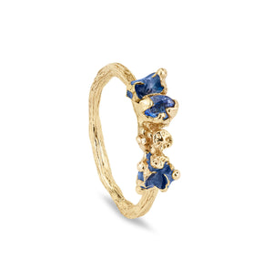 Handmade gold ring with twig band and berry clusters. A blue sapphire is organically set and there is blue enamel to each side also. One of a kind ring.