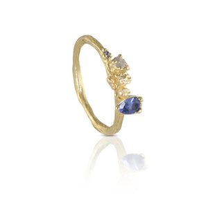 9 carat gold ring with sapphire, raw diamond and another blue sapphire set in twig texture band. 